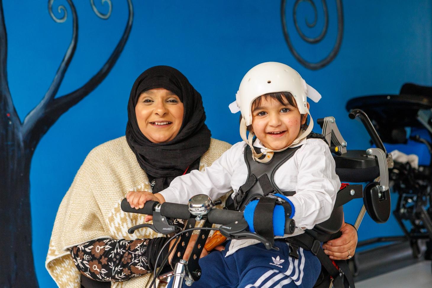 Siddique and his mum smiling at the camera