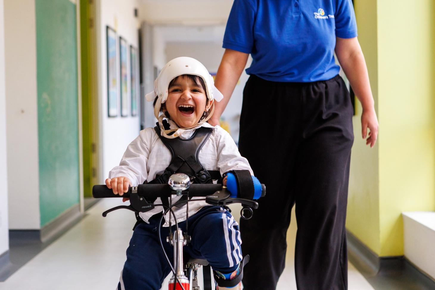 Siddique riding his bike smiling