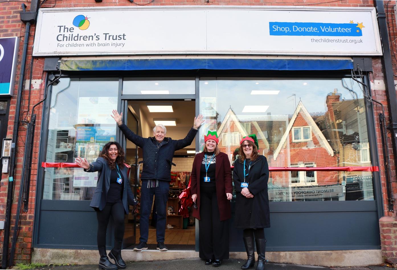Nicholas Owen and staff in front of the shop