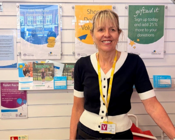 Sally wearing her marathon medal 