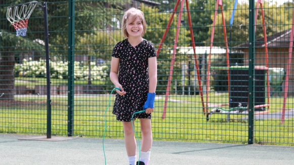 Marnie outside with a skipping rope.