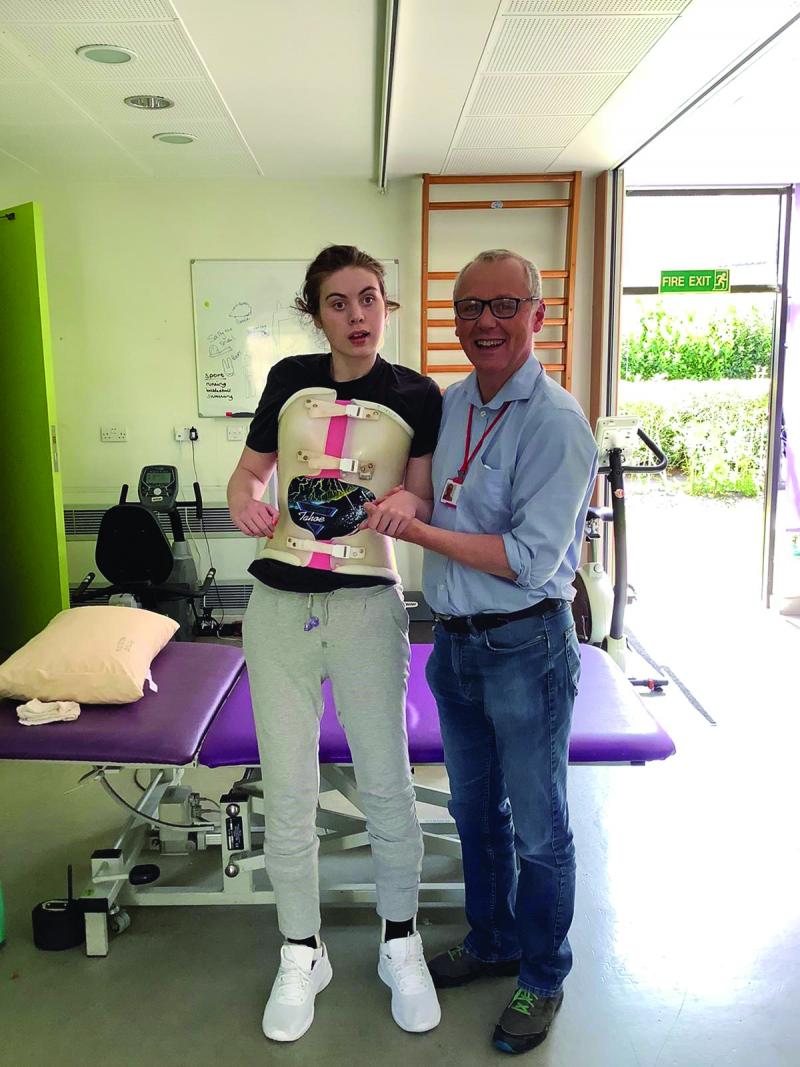 Floss standing with her dad Robin