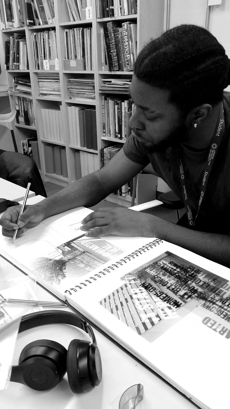 Godi with his artwork 