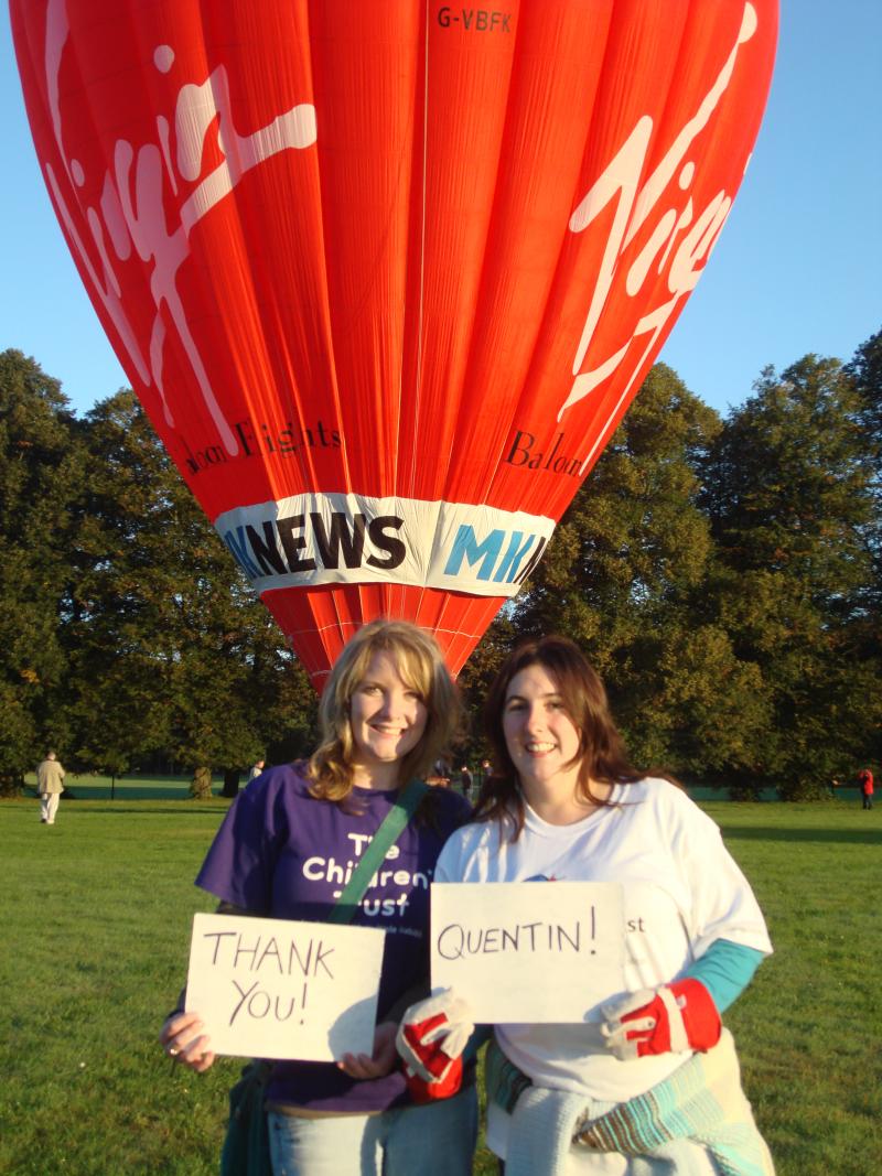 Jade in front of a hot air balloon