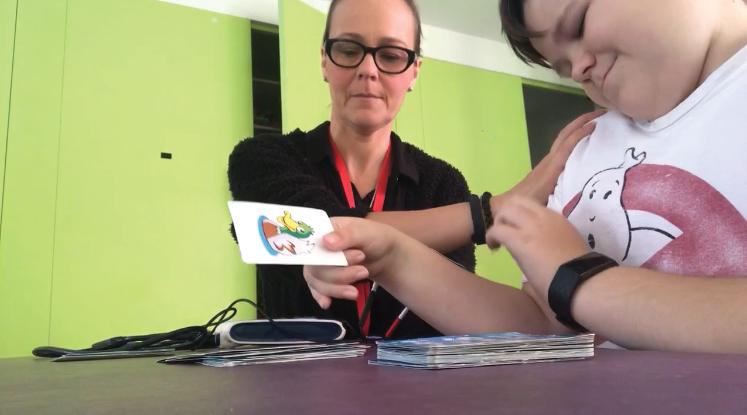 Joey playing cards with his mum at The Children's Trust