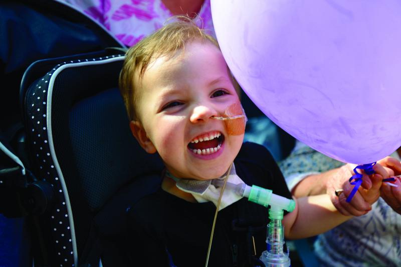 Josh celebrating with a balloon