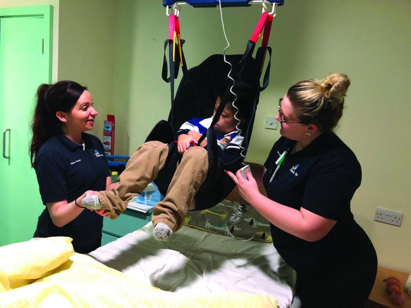 Kenny being hoisted at The Children's Trust