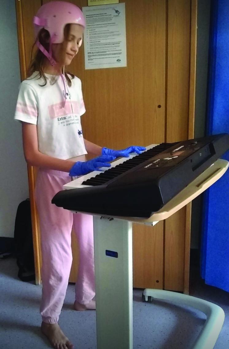 Mia playing the keyboard