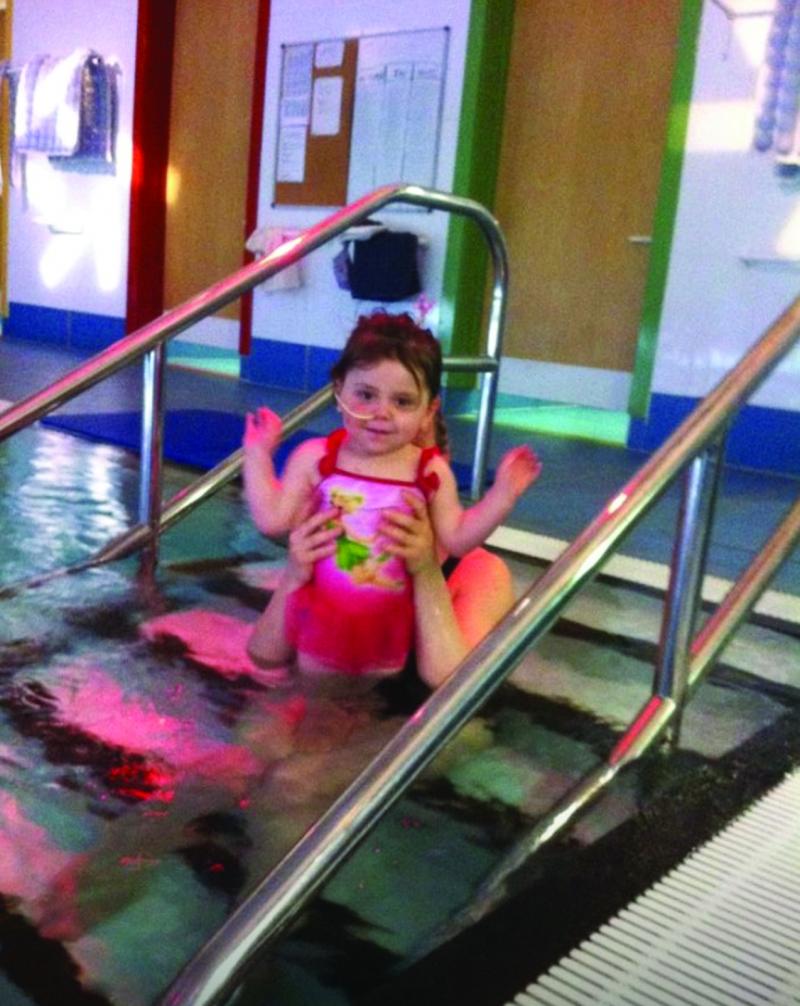 Millie in the hydro pool at The Children's Trust