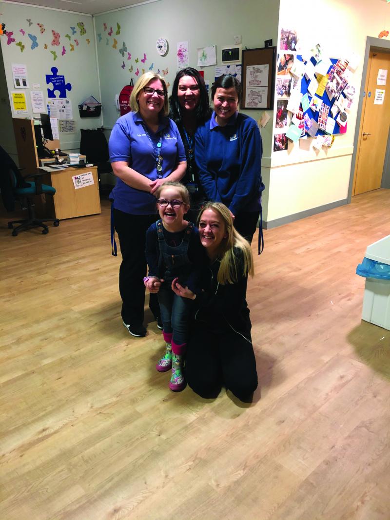 Mollie with staff at The Children's Trust