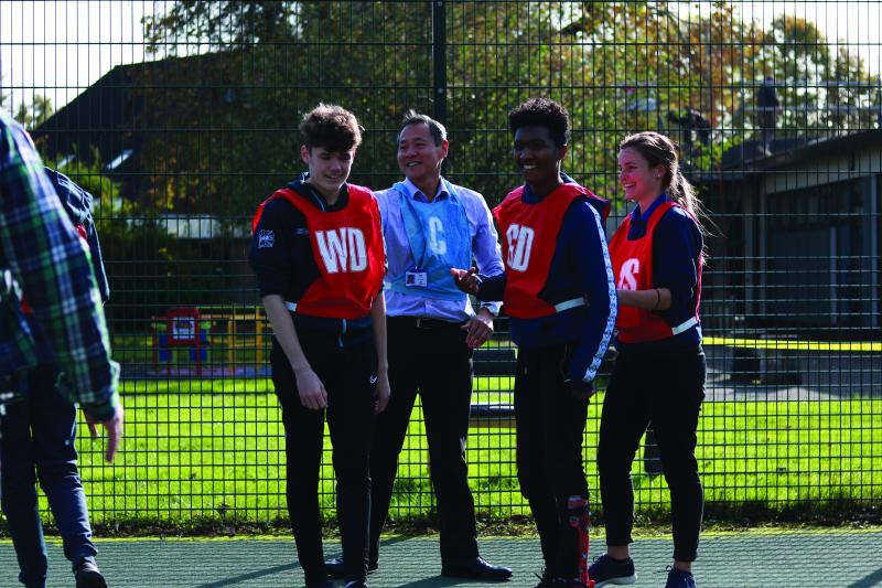 Sam playing football at The Children's Trust with Jake and Dalton