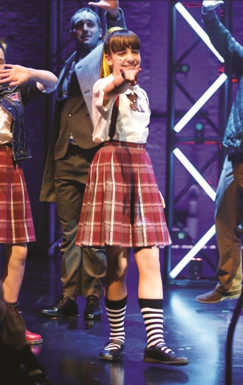 Savannah performing in School of Rock the musical