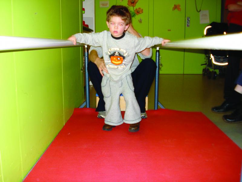 Tommy learning to walk at The Children's Trust
