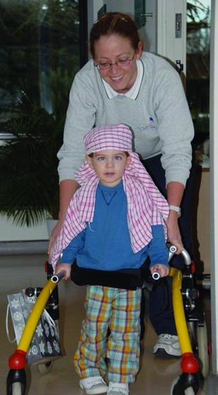 Tommy in a walker at The Children's Trust
