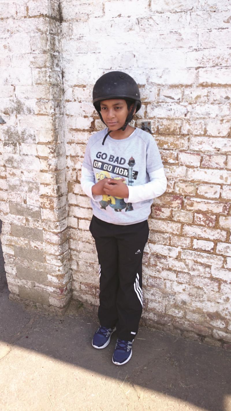 Velstrin with a riding helmet on