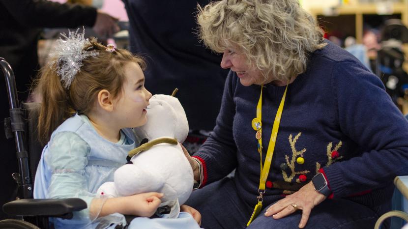 Olivia with school volunteer