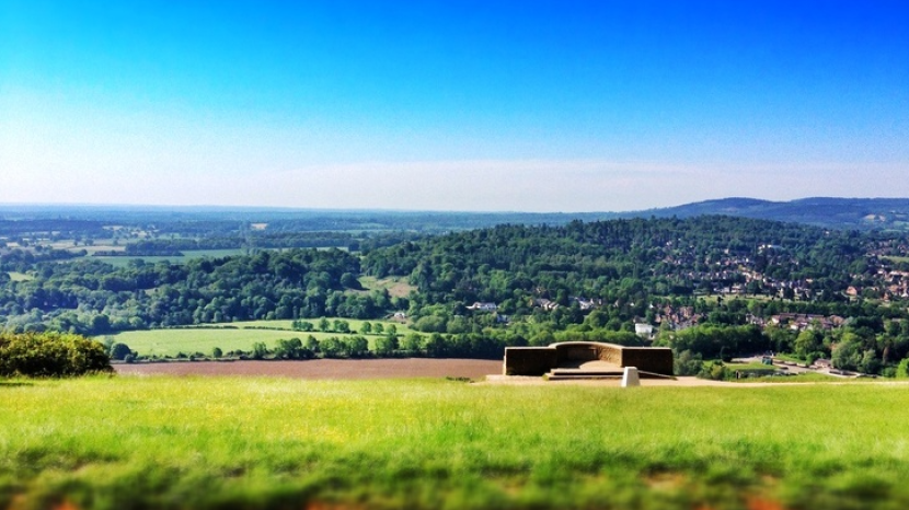 sprawling Surrey green hills from the ancient viewpoint at Box Hill set against turquoise skies